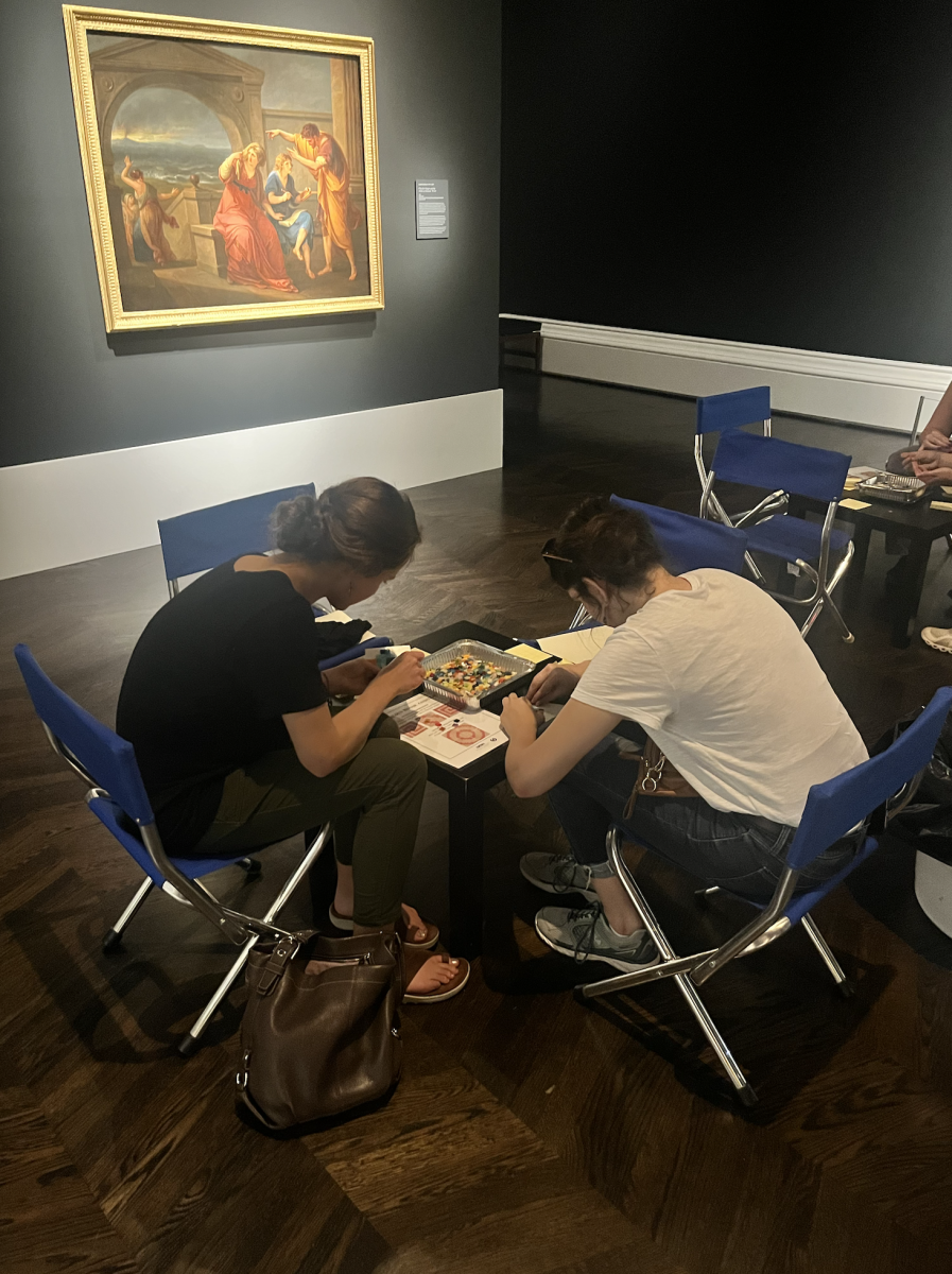 SMU students making mosaic coasters with SMU's Classical Studies Club. Other activities included bracelet making, typewriter poetry, and a gallery-wide puzzle.